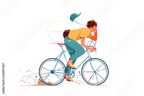 Young man rides sport bicycle listening to music