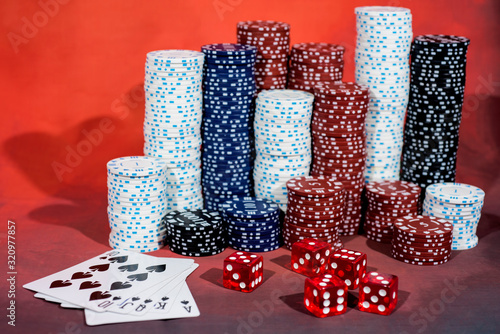 Casino abstract photo. Poker game on red background.  Theme of gambling. photo