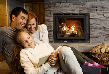 Happy Christmas family, Loving parents with child girl sitting n