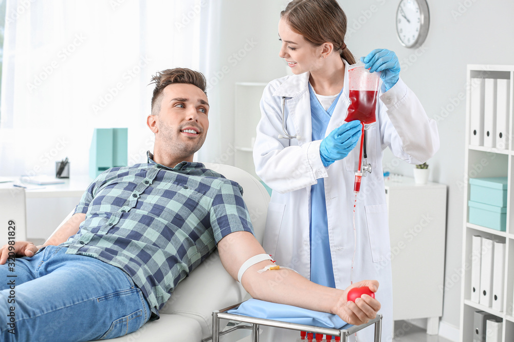 Fototapeta premium Man donating blood in hospital