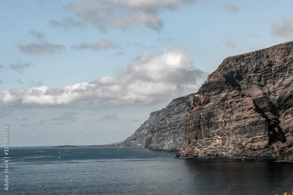 Huge majestic cliffs of Los Gigantes in an unusual light. Only the sea and the rocks.