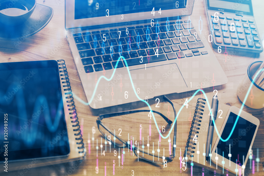Financial market graph hologram and personal computer on background. Double exposure. Concept of forex. Financial market graph hologram and personal computer on background. Double exposure. Concept of forex.