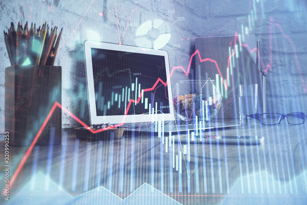 Financial graph colorful drawing and table with computer on background. Multi exposure. Concept of international markets. Financial graph colorful drawing and table with computer on background. Multi exposure. Concept of international markets.