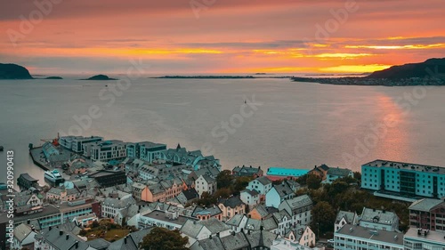 Alesund, Norway. Amazing Natural Bright Dramatic Sky In Warm Colours Above Alesund Valderoya And Islands In Sunset Time. Colorful Sky Background. Beauty In Norwegian Nature. 4K photo