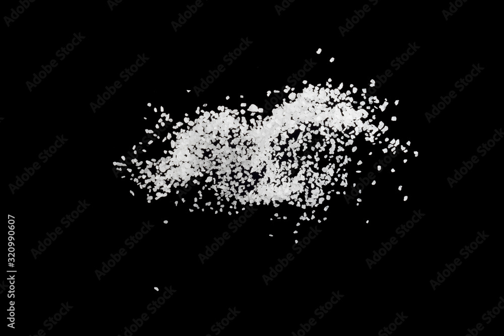 Obraz premium Sea salt explosion isolated on black background close up