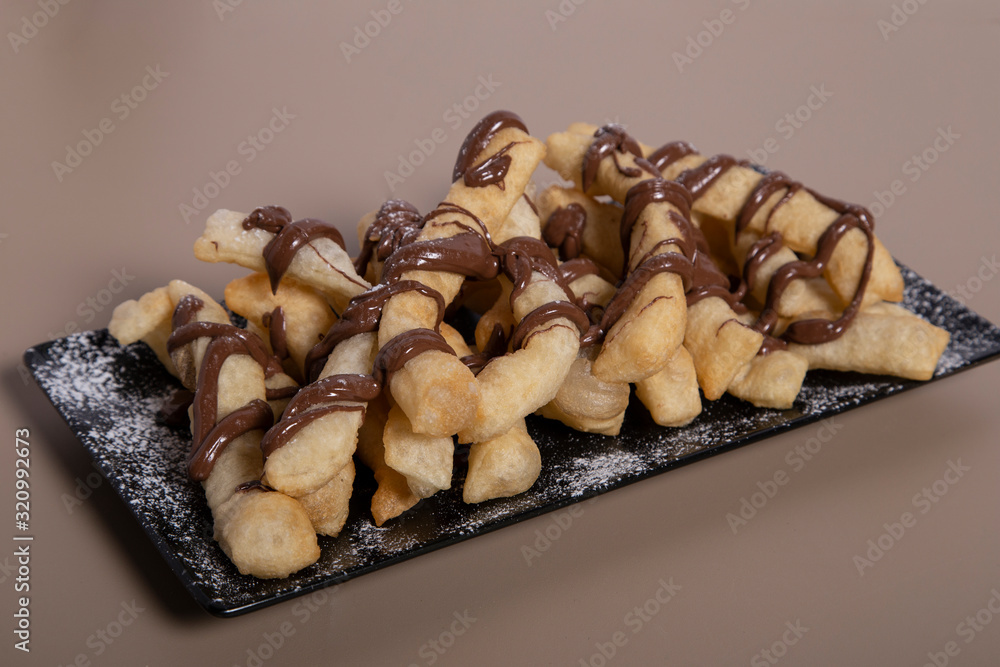 Typical Neapolitan dessert with nutella and powdered sugar. Typical Neapolitan dessert with nutella and powdered sugar.