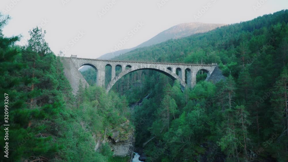 fast flowing river under a old stone bridge - Kylling bru in Norway fast flowing river under a old stone bridge - Kylling bru in Norway