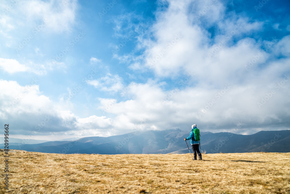 Young woman hiking in the mountains Young woman hiking in the mountains