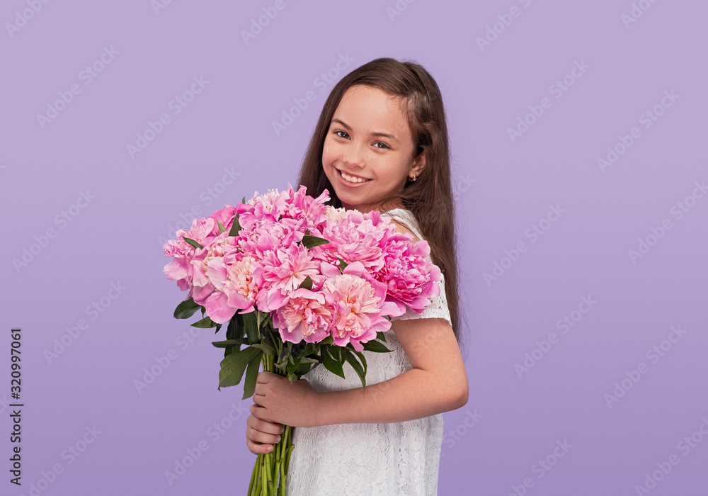 Happy teen girl with pink flowers Happy teen girl with pink flowers