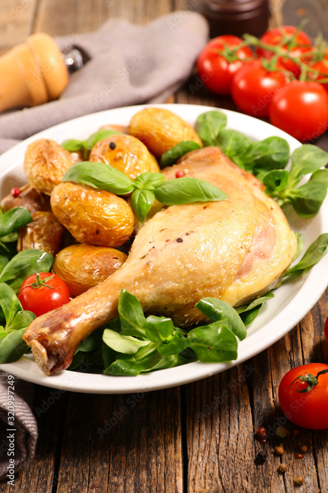 grilled chicken leg with roasted potato and lettuce grilled chicken leg with roasted potato and lettuce