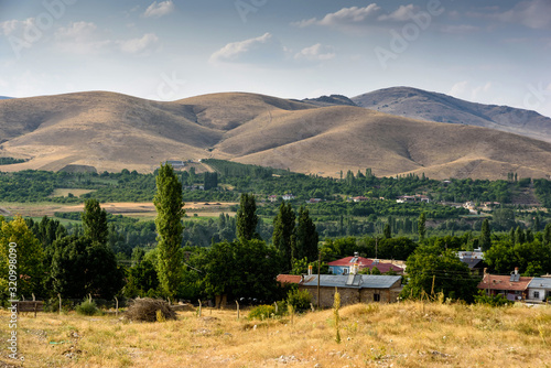 Bild auf Leinwand Village close the Turkish national Park aladag with mountain background behind w