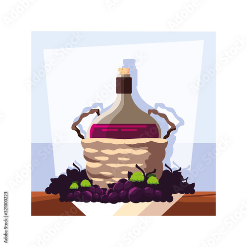 bottle of wine in wicker basket and grapes