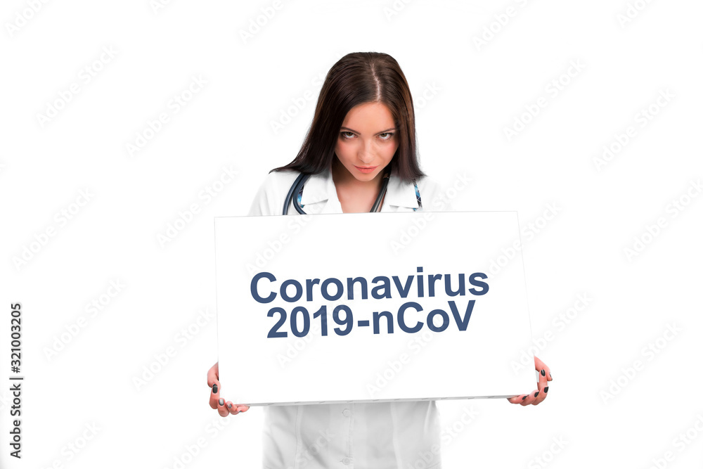 portrait of young doctor with stethoscope showing clipboard with text Coronavirus. 2019-nCoV portrait of young doctor with stethoscope showing clipboard with text Coronavirus. 2019-nCoV