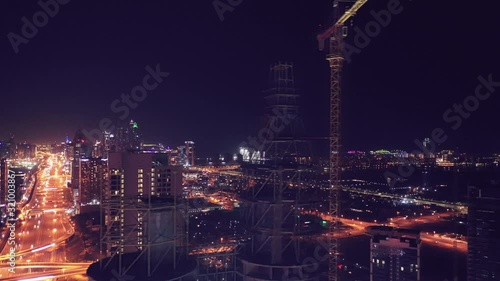 Wallpaper Mural Aerial night illuminated Dubai city skyline skyscrapers view and  busy traffic on Sheikh Zayed road  highway Torontodigital.ca