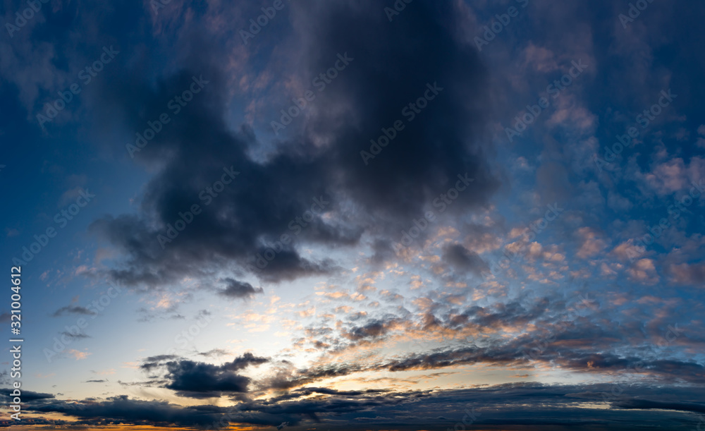 Fantastic dark thunderclouds at sunrise