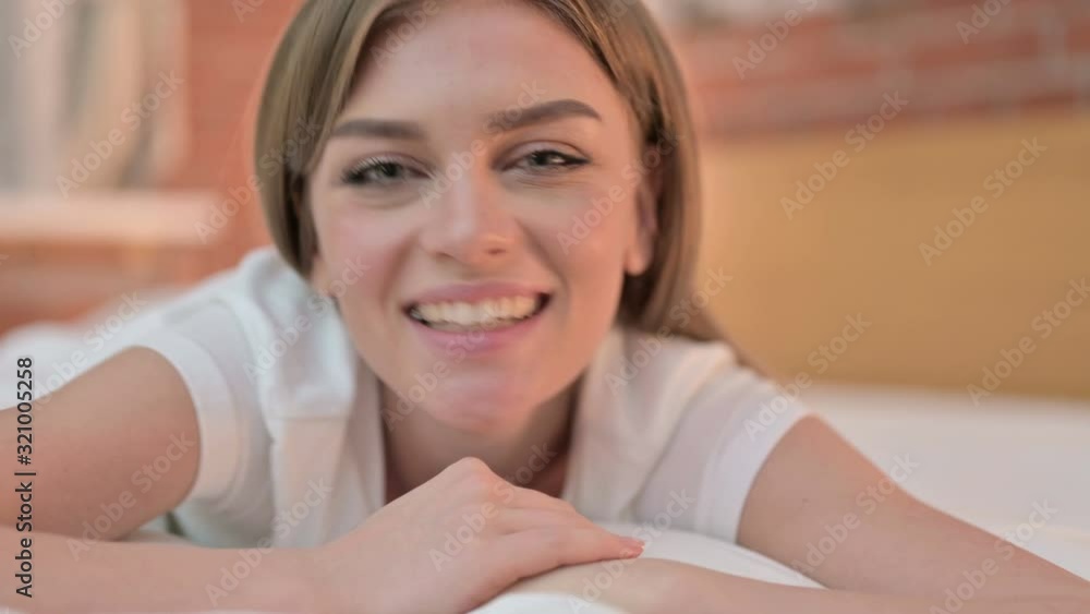 Close up of Beautiful Young Woman doing Video Chat in Bed Close up of Beautiful Young Woman doing Video Chat in Bed