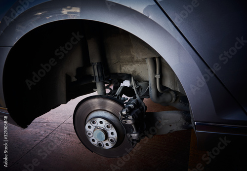 Car brake disk and tyre change at a car repair shop
