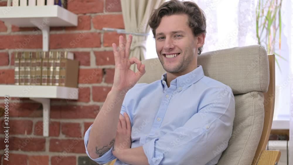 Cheerful Young Man Showing Ok Sign Cheerful Young Man Showing Ok Sign