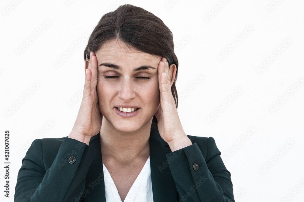 Tired young business lady trying to concentrate. Young woman in office jacket suffering from headache. Headache concept Tired young business lady trying to concentrate. Young woman in office jacket suffering from headache. Headache concept
