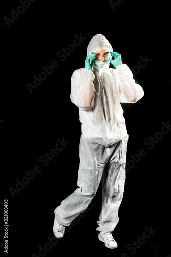 doctor in protective suit on black in studio.Laboratory diagnosis treatment analysis virus study coronavirus © irishasel
