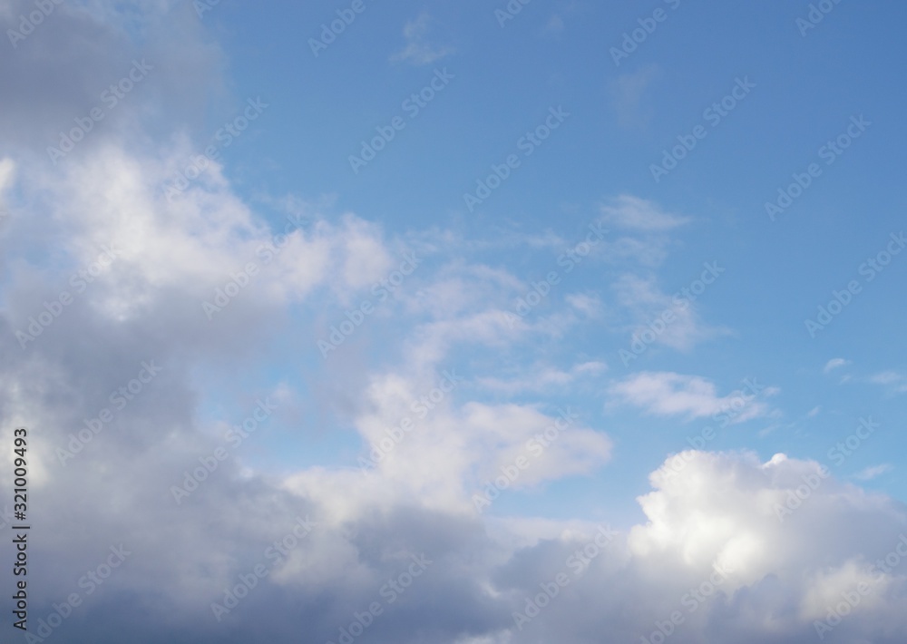  beautiful blue and gray background made of clear sky and small clouds