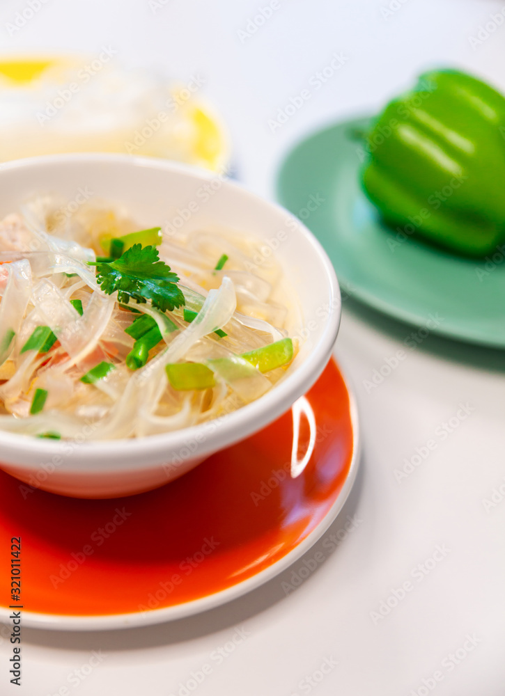 Soup with cellophane noodles, chicken and sweet green pepper. Soup with cellophane noodles, chicken and sweet green pepper.