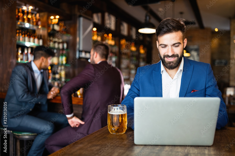 Young business man having a break in a restaurant. Work occupation business lifestyle concept Young business man having a break in a restaurant. Work occupation business lifestyle concept