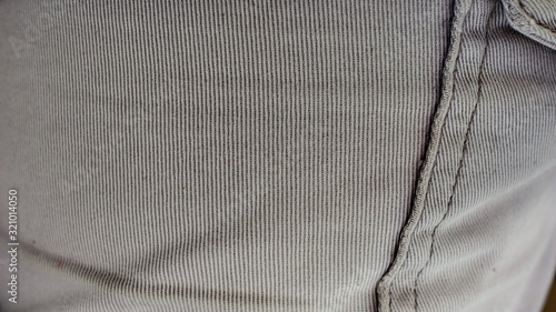 Gray fabric texture, with folds, selectively focused