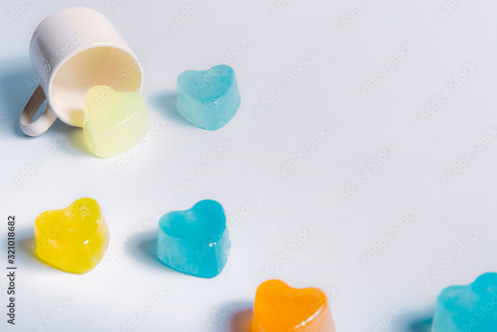 Small cake shaped in a coffee cup on a white background for valentines day. Small cake shaped in a coffee cup on a white background for valentines day.