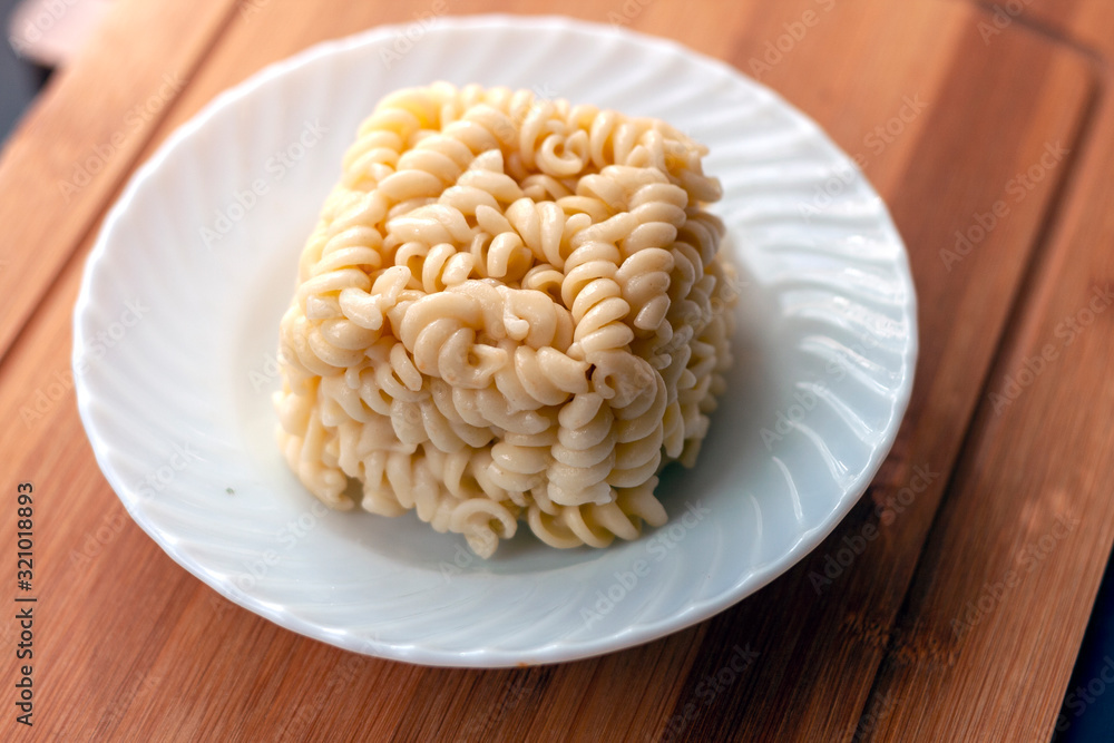 cube block shaped Leftover Cooked Pasta in the plate cube block shaped Leftover Cooked Pasta in the plate