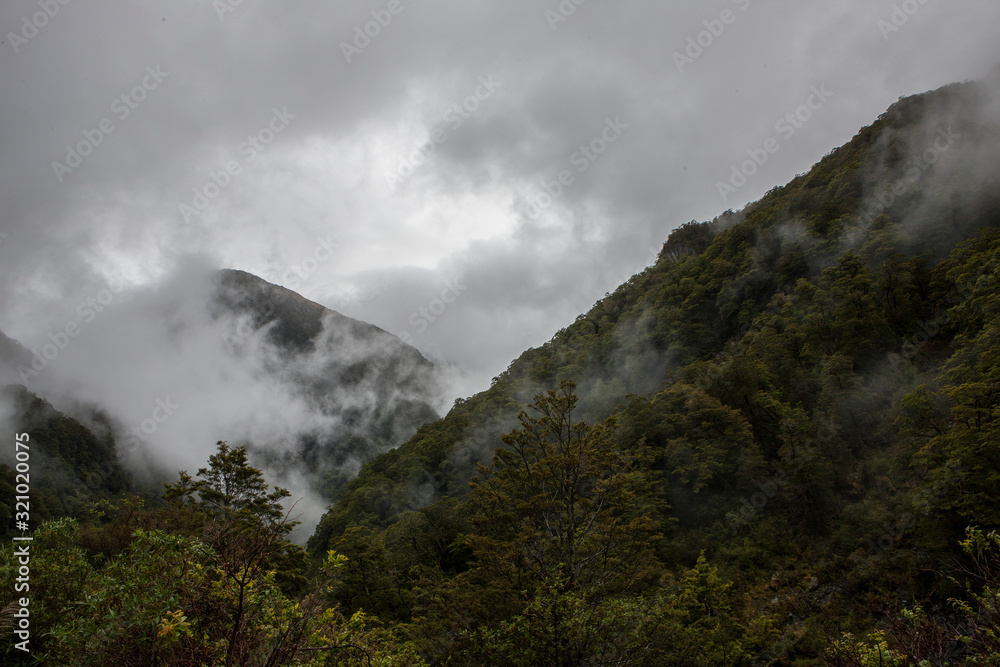 Mountains and clouds Mount Aspiring National Park. Haast highway 6. Westcoast New Zealand.