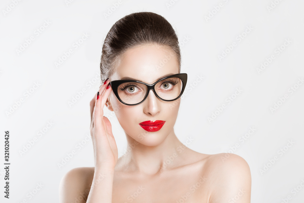 Vision. Closeup attractive fashion sexy girl wearing eye glasses woman holding her pair of glasses isolated white light grey background wall Vision. Closeup attractive fashion sexy girl wearing eye glasses woman holding her pair of glasses isolated white light grey background wall