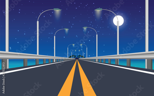 landscape of road across the sea in night time	