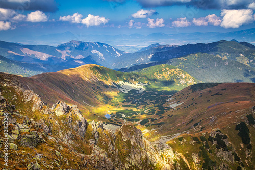 Mountainous landscape with hills and valleys at a sunny day in autumn season. The Low Tatras National Park in Slovakia, Europe. photo