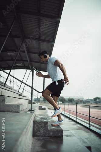 Man working out on stadium steps