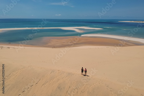 Ocean and Beach Panorama with Couple in Foreground 