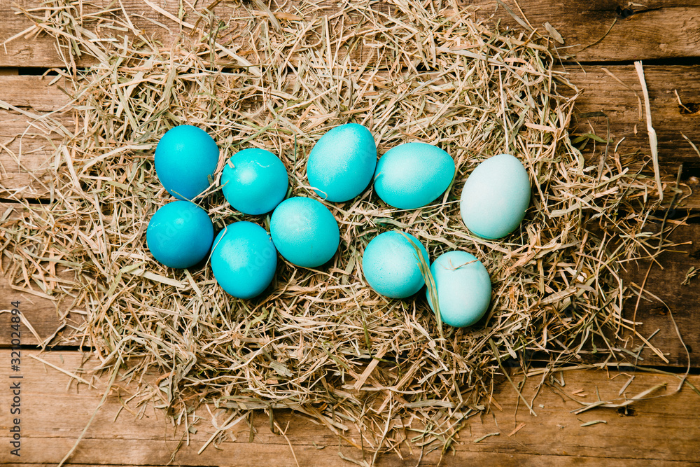 Ten easter eggs in blue gradient color design. On a wooden vintage background.. Ten easter eggs in blue gradient color design. On a wooden vintage background..