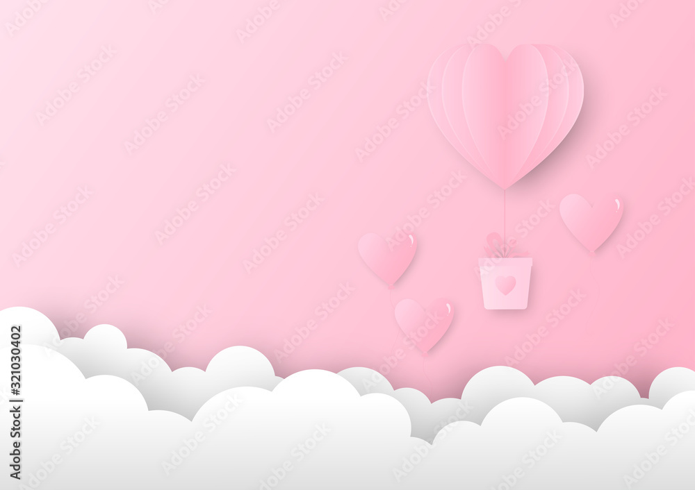 Pink paper heart shape balloon  hanging a pink gift box floating in the sky