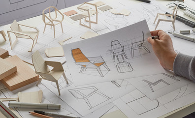 Designer sketching drawing design development product plan draft chair armchair Wingback Interior furniture prototype manufacturing production. designer studio concept .