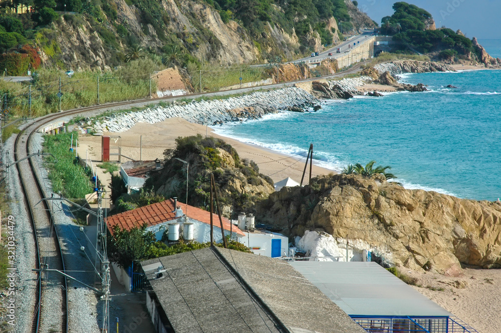 View from the highway to the railway, houses and the Mediterranean Sea. Catalonia, Spain