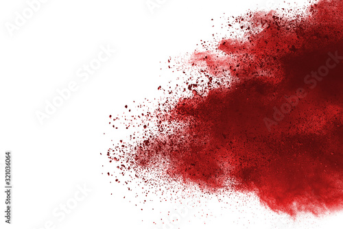 Red powder explosion on white background. Colored cloud. Colorful dust explode. Paint Holi.