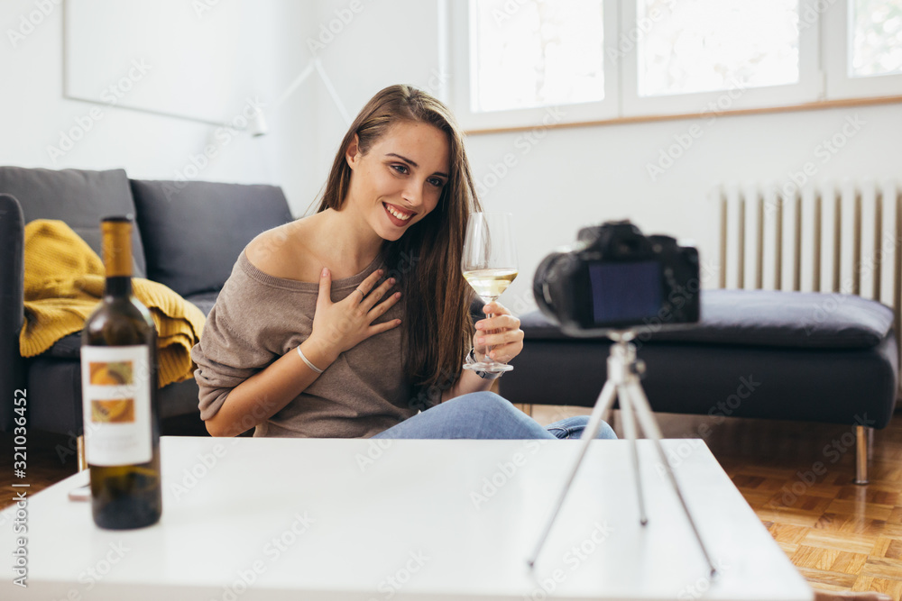 woman making video blog about wines woman making video blog about wines
