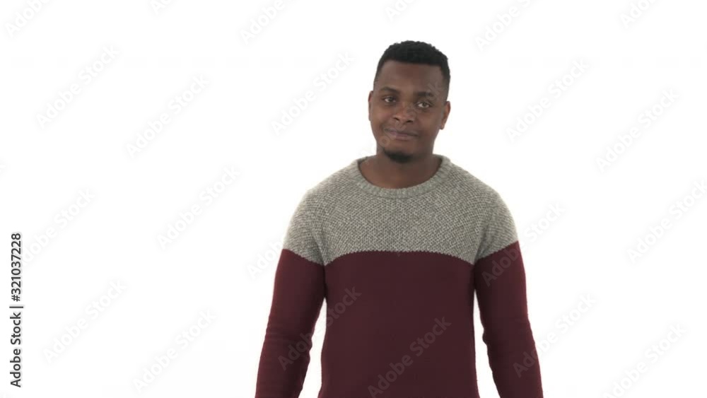Handsome man pointing with index finger to the right and showing hey you sign. Hand sign, confident gesture. Isolated, on white background Handsome man pointing with index finger to the right and showing hey you sign. Hand sign, confident gesture. Isolated, on white background