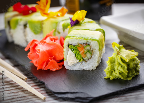 Tasty sushi set. Japanese traditional dishes. Rice rolls. Close up.