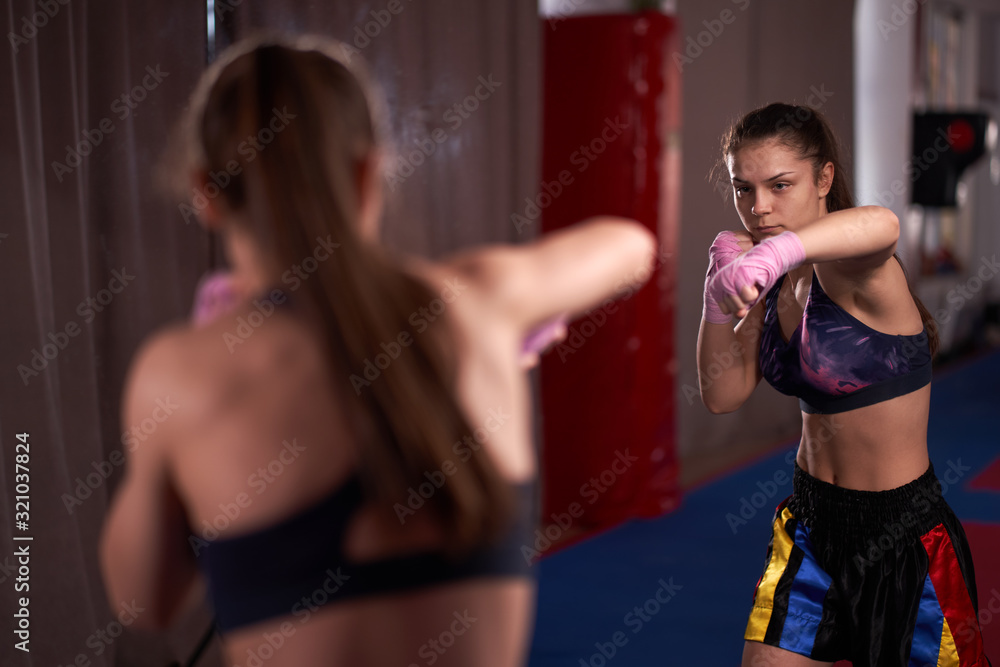Fototapeta premium Boxer girl shadow boxing