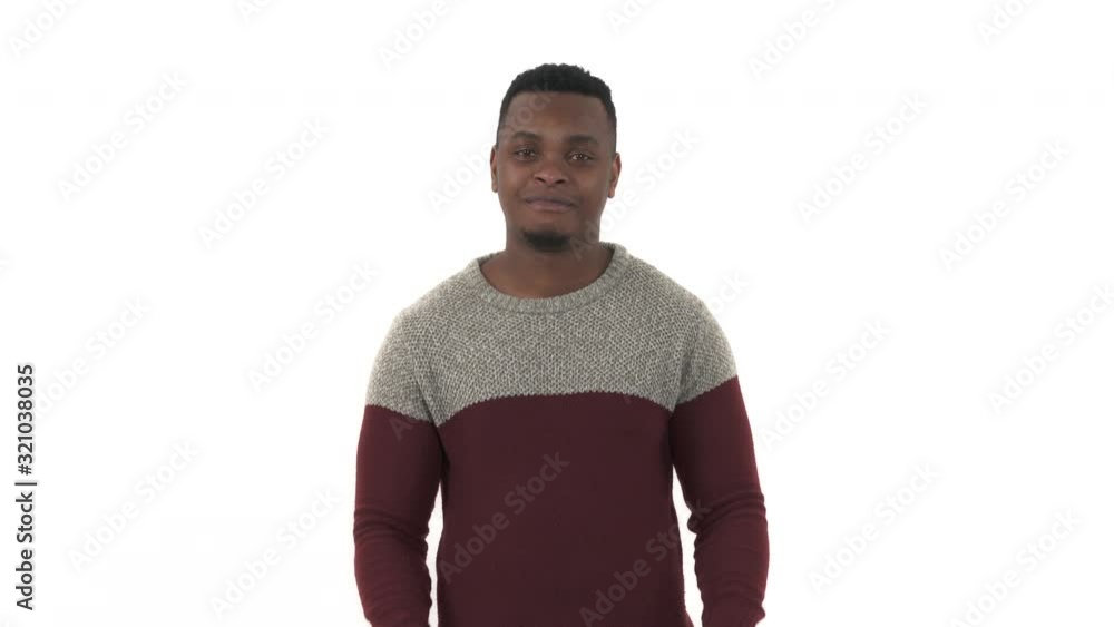 Portrait of a happy young man pointing index fingers up. Isolated over white background Portrait of a happy young man pointing index fingers up. Isolated over white background