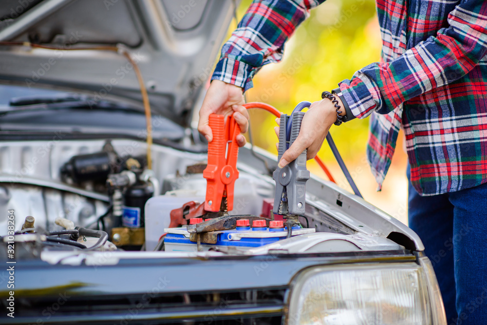 Fototapeta premium Help low battery car , battery cable copper wire