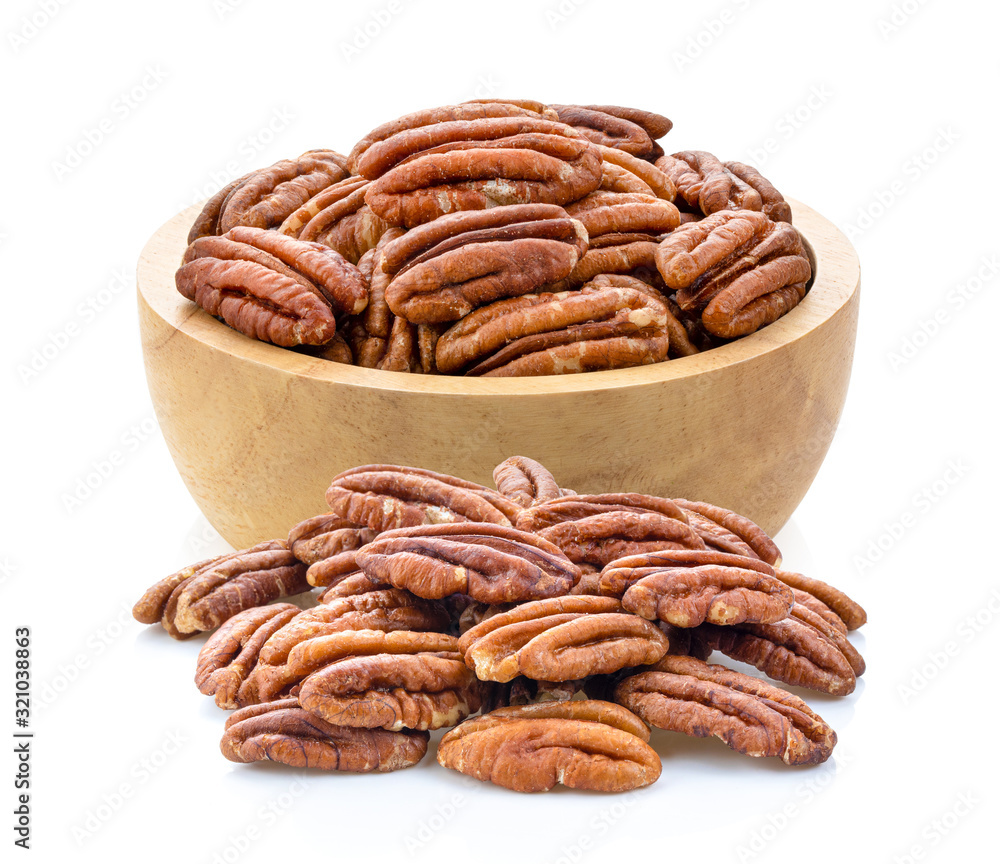 Pecans in wood bowl on a white background Pecans in wood bowl on a white background