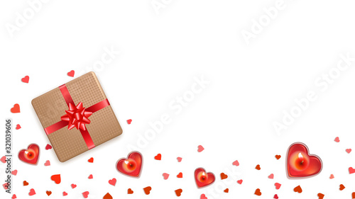 Flat lay Valentines Day background with red hearts. Candles in form of heart and gifts with ribbon bow on wooden table. Romantic template design for greeting card, wedding, banners, posters. Top view