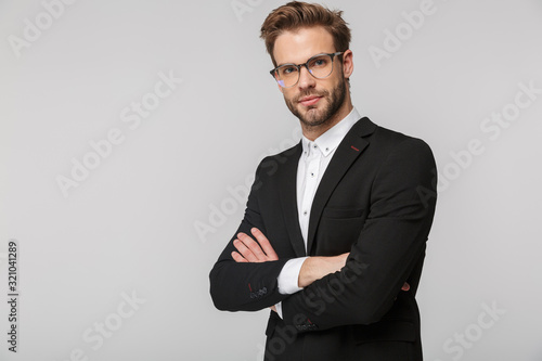 Portrait of handsome businessman posing and looking at camera
